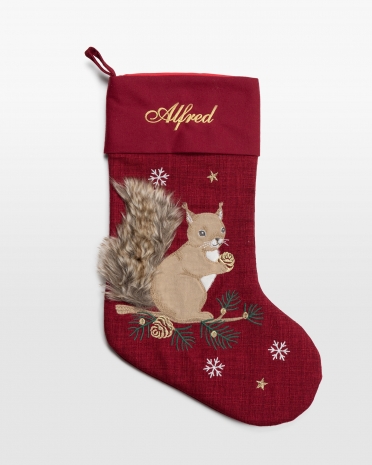 Röd julstrumpa med namn och motiv