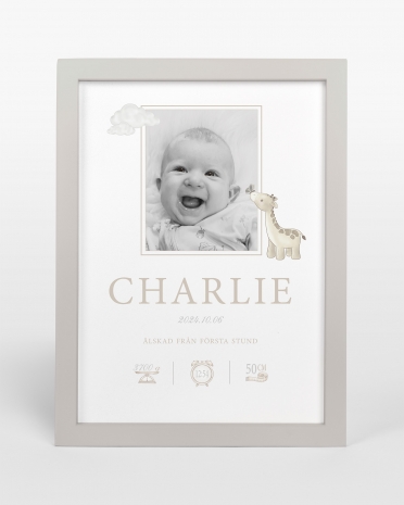 Doptavla med barnets namn och födelseuppgifter