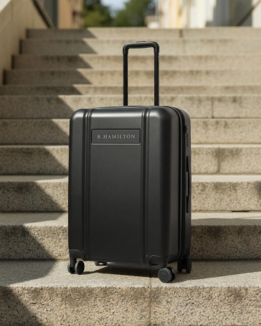 Personligt graverad mörkgrå resväska