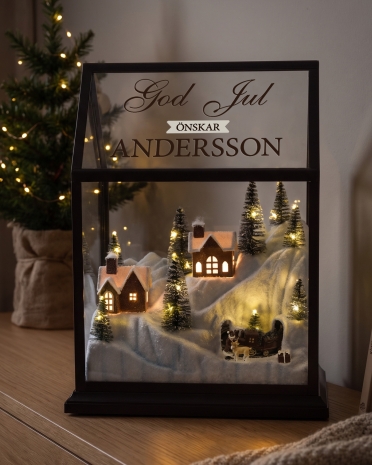 Julby med åkande tåg och belysning, kommer med personlig hälsning