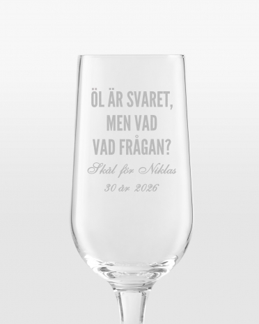 ölglas med graverat namn och citat