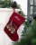 Röd julstrumpa med tågmotiv och broderat namn