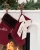 Julstrumpa i rött sammetsmaterial med namn och rosett