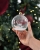 Julkula i glas med namn och motiv av en gunghäst