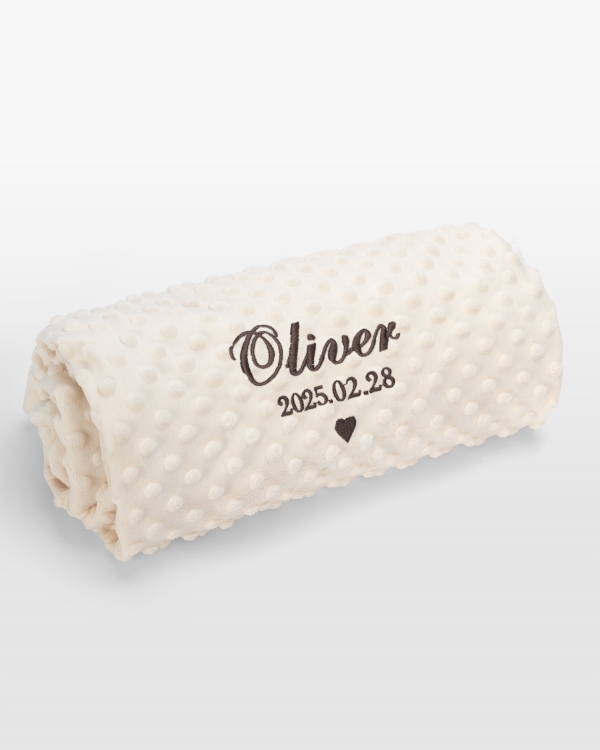 Creme-färgad babyfilt med brun brodyr