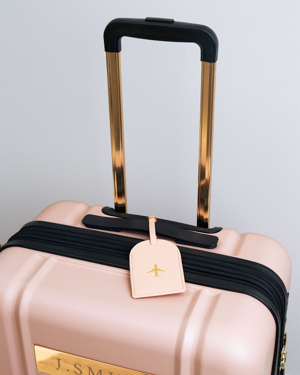 Rosa bagagelapp med adress