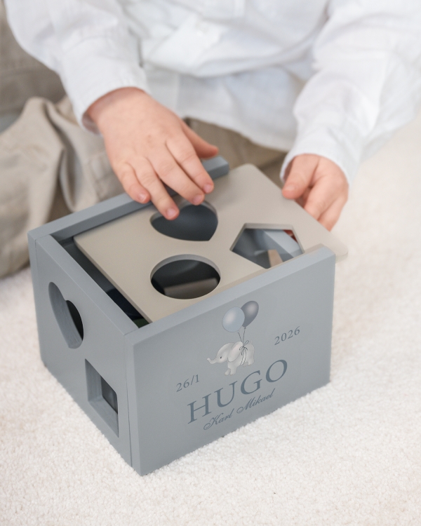 Plocklåda med klossar och personlig märkning