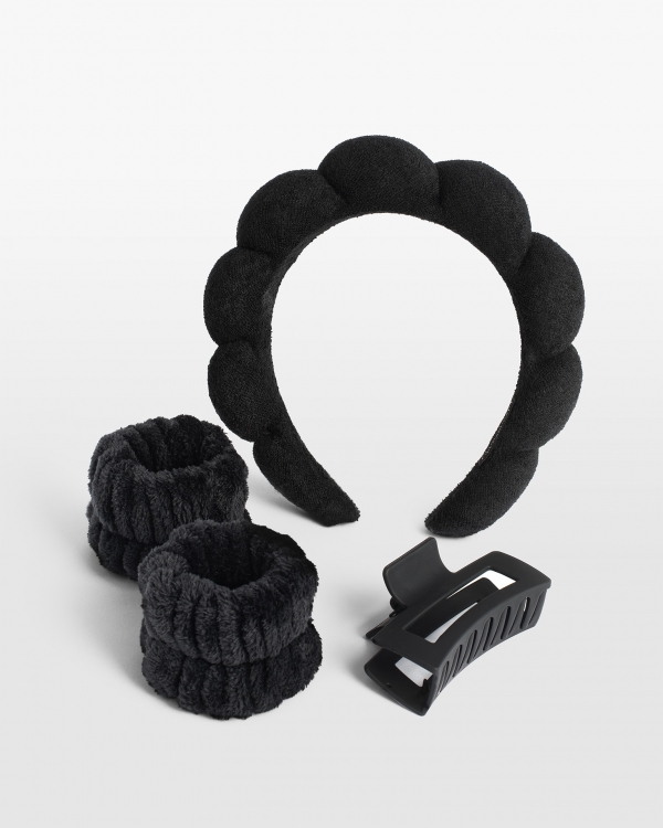 Set med svart hårband, hårklämma och armband