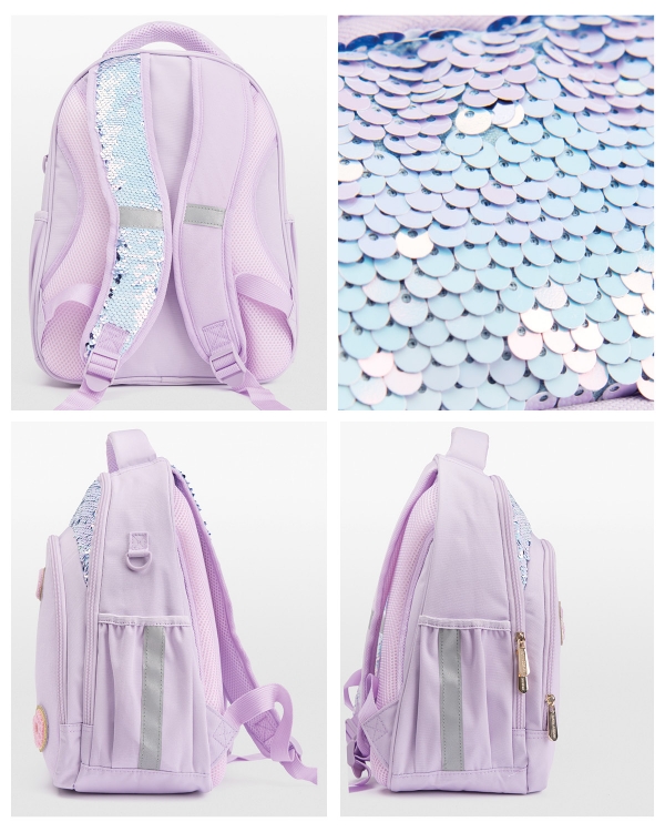 lila barnryggsäck med tygmärken