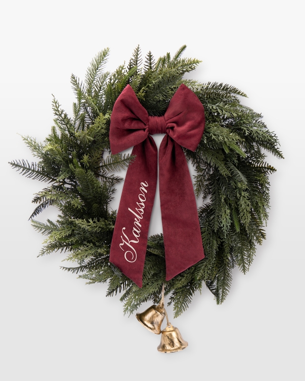 Personlig julkrans med röd rosett och valfritt namn
