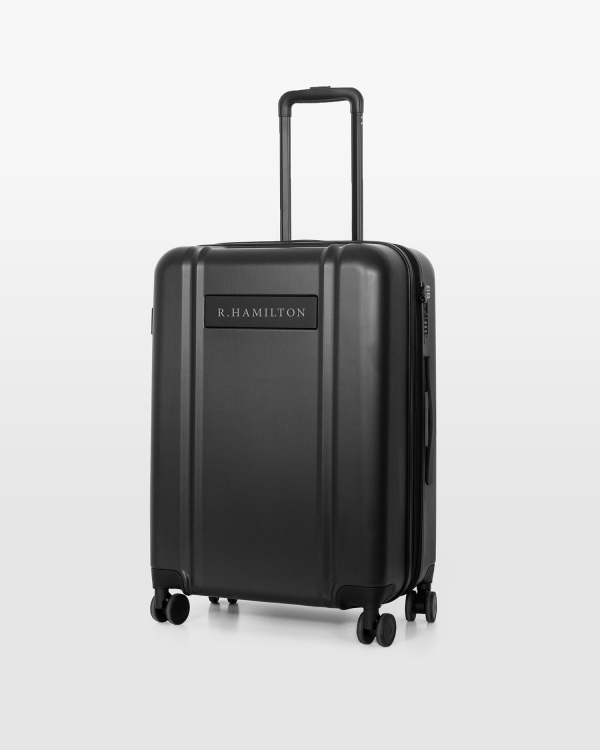 Mörkgrå resväska med namn och svarta detaljer