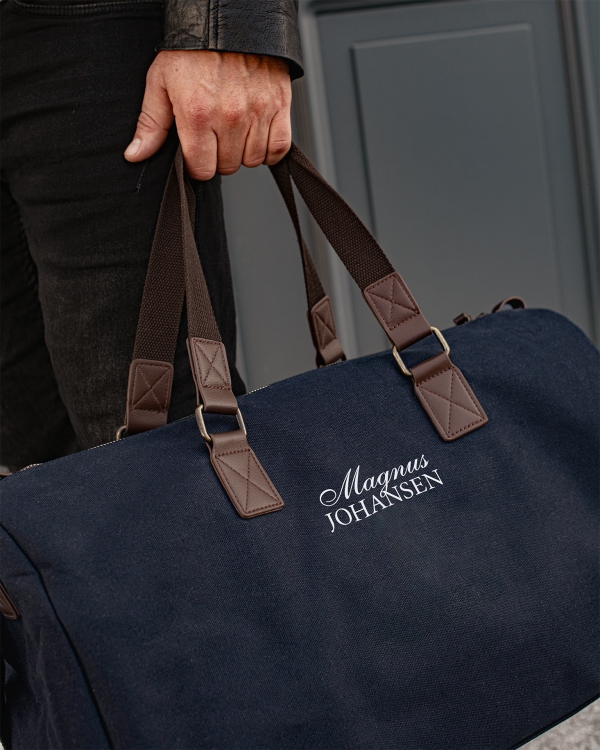Marinblå duffle bag med namn i set