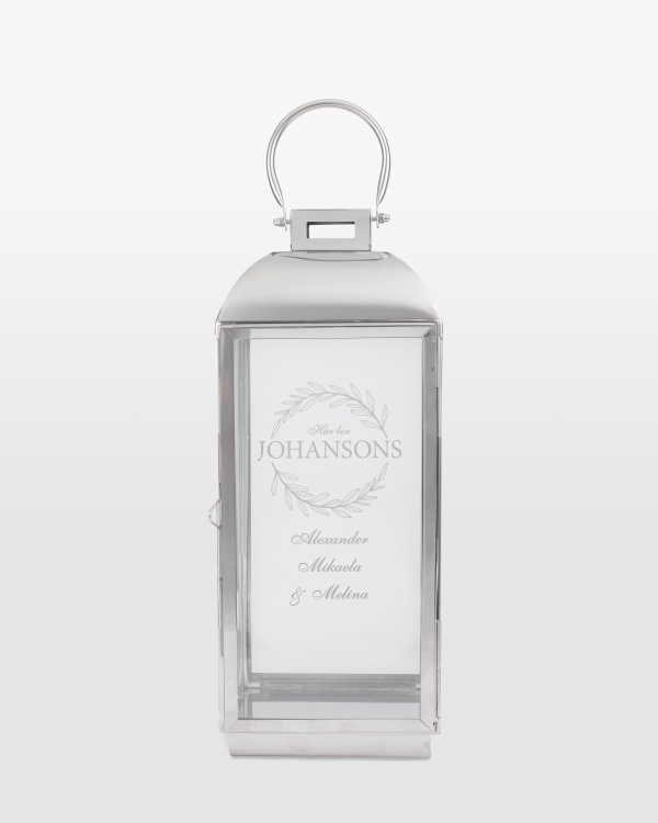 Silverfärgad ljuslykta med namn