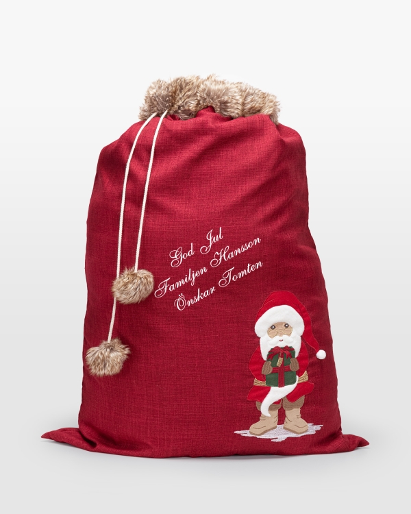 Röd julklappssäck med personlig hälsning, perfekt för unika julklappar och festlig förvaring